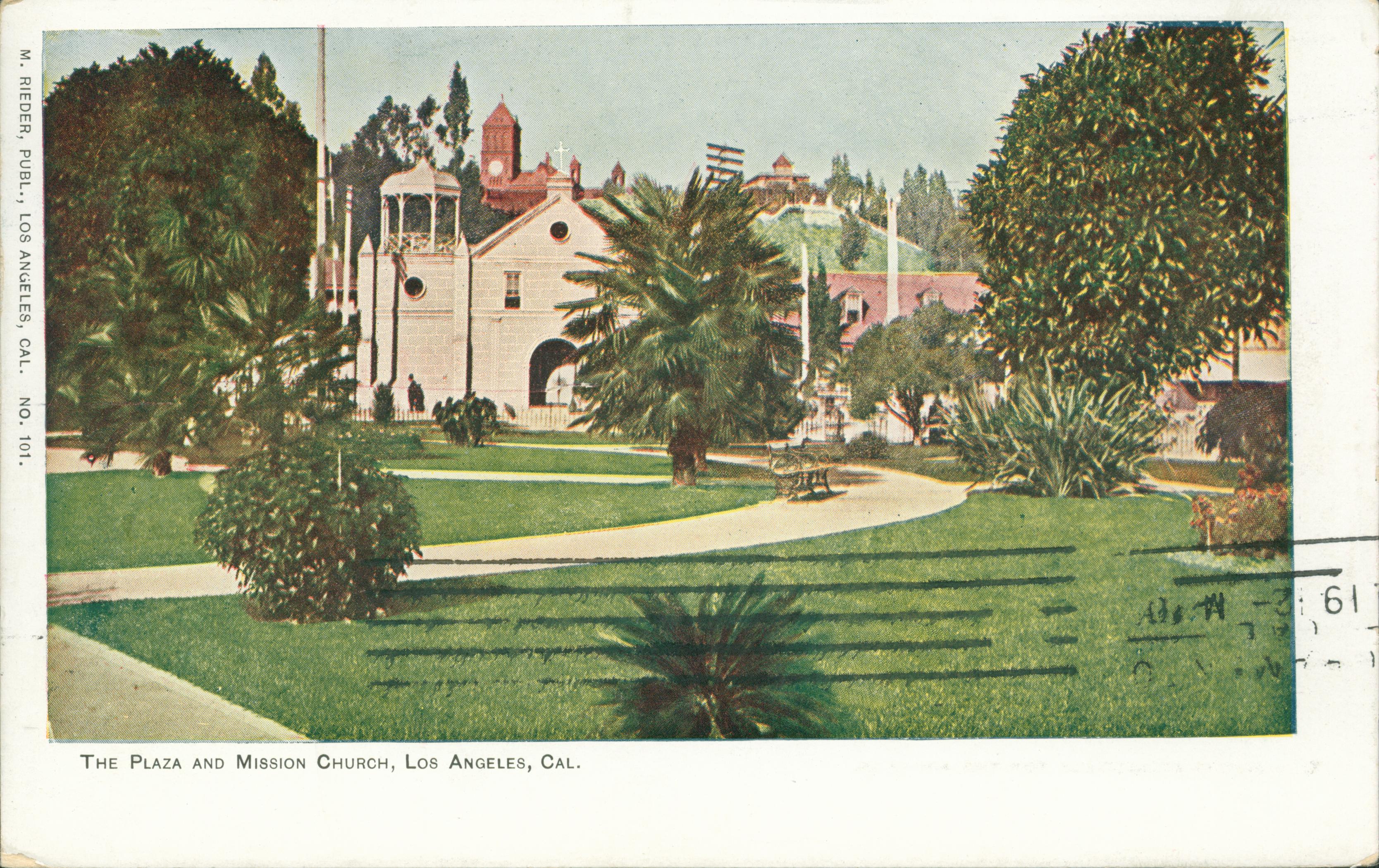 This postcard shows the Plaza Church in Los Angeles, facing a front park.